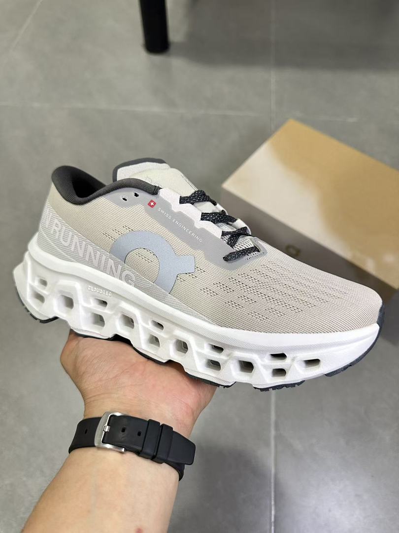 On Running Cloudmonster Sneakers in Gray and White
