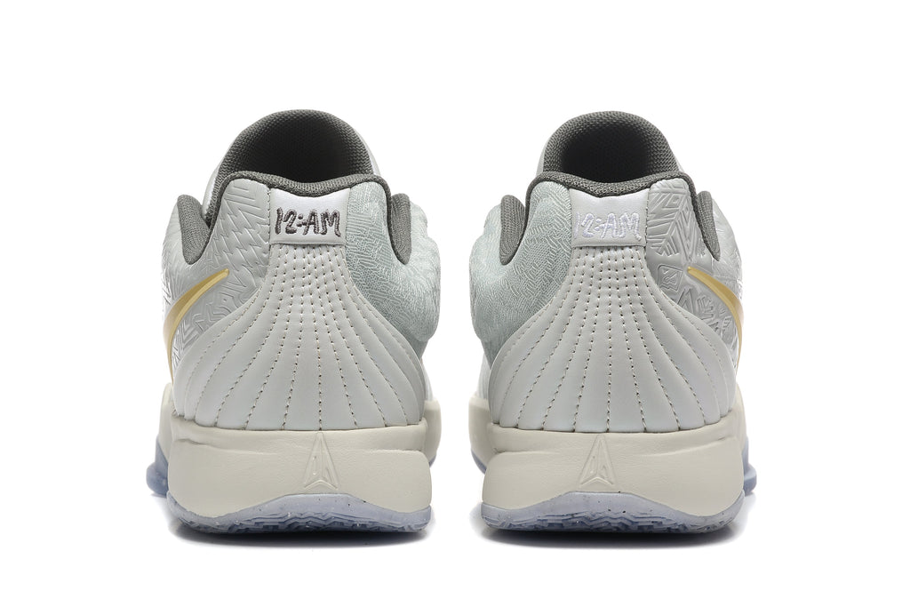 Nike Kyrie Low Basketball Shoes in Gray and Gold