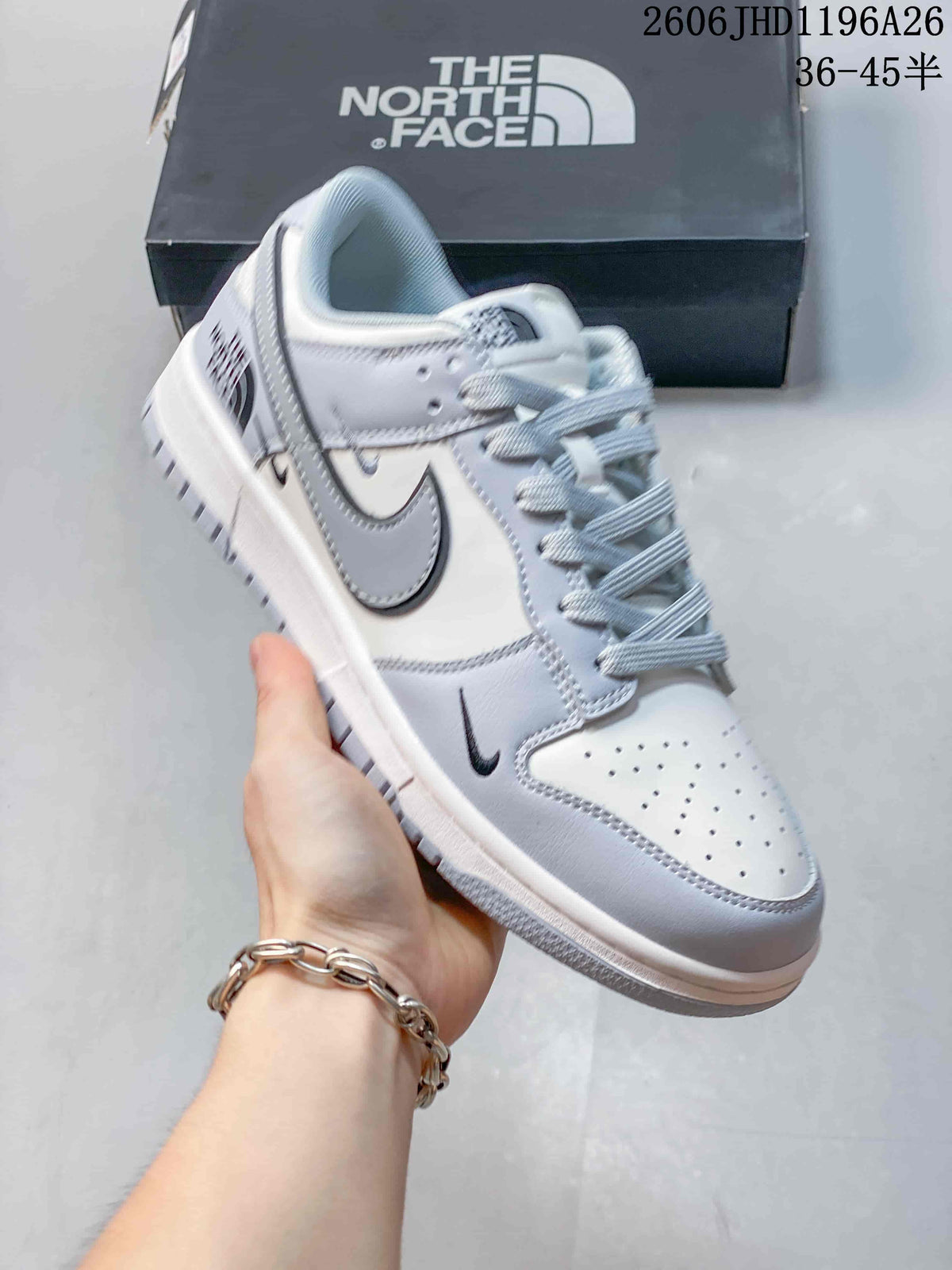 Nike SB Dunk Low Sneakers in White and Gray
