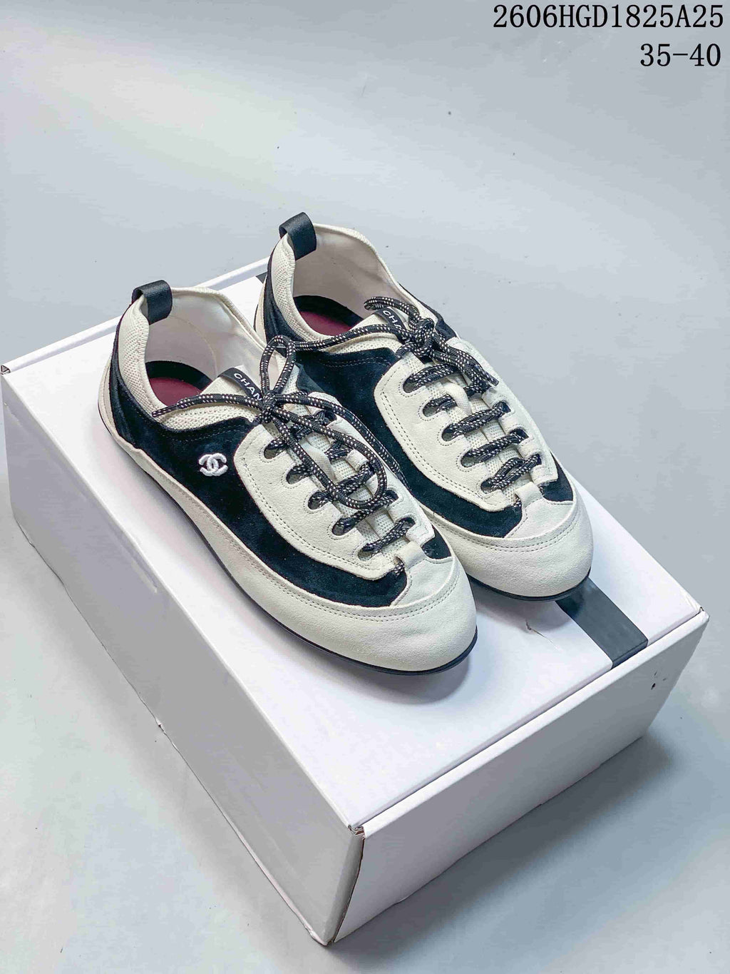 Chanel Two-Tone Low-Top Sneakers, Black and White, 2606HGD1825A25
