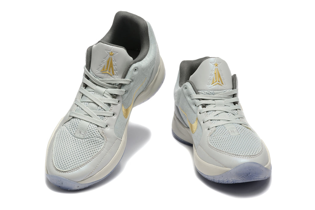 Nike Kyrie Low Basketball Shoes in Gray and Gold