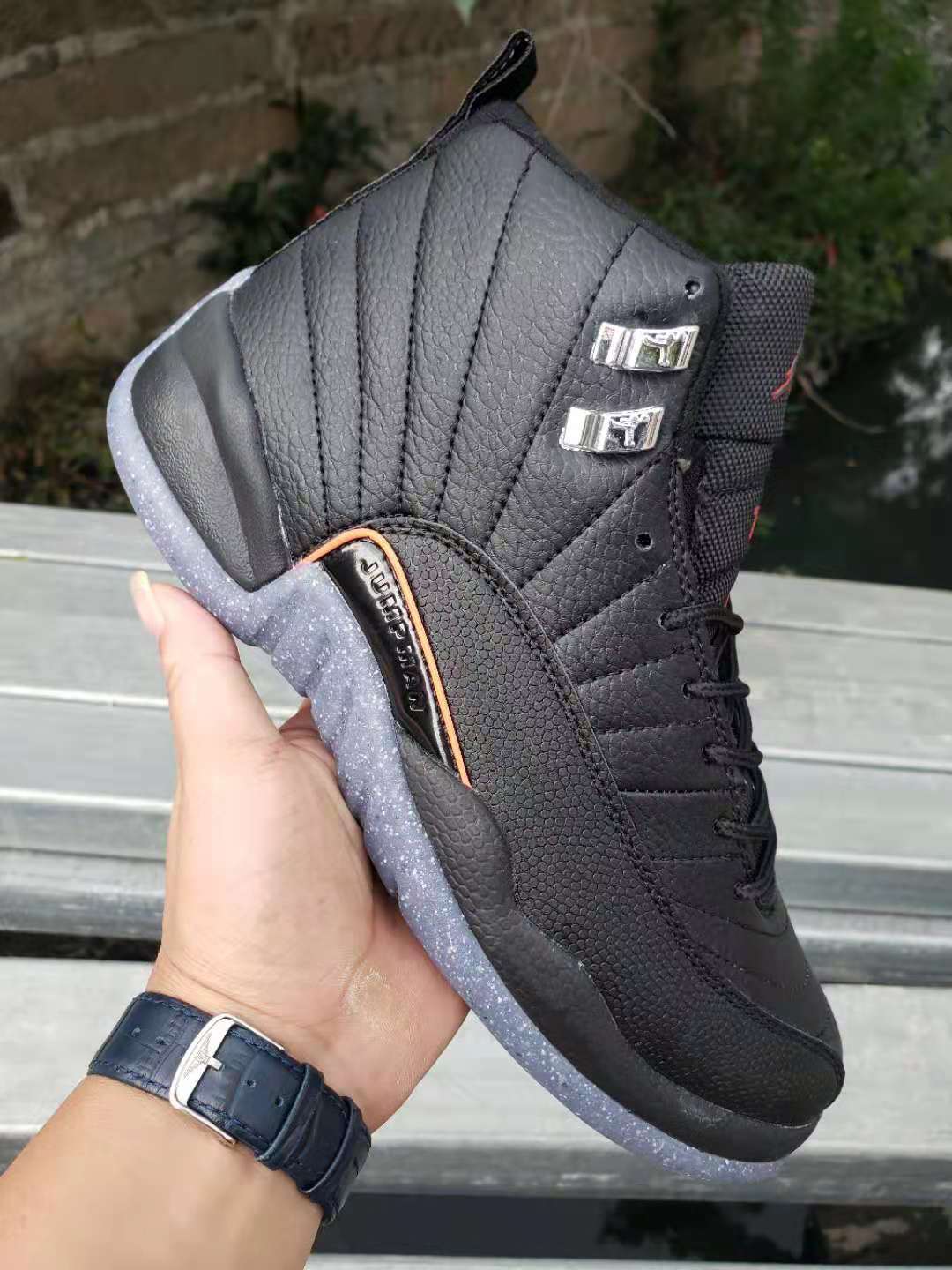 Jordan 12 High-Top Sneakers in Black with Speckled Sole