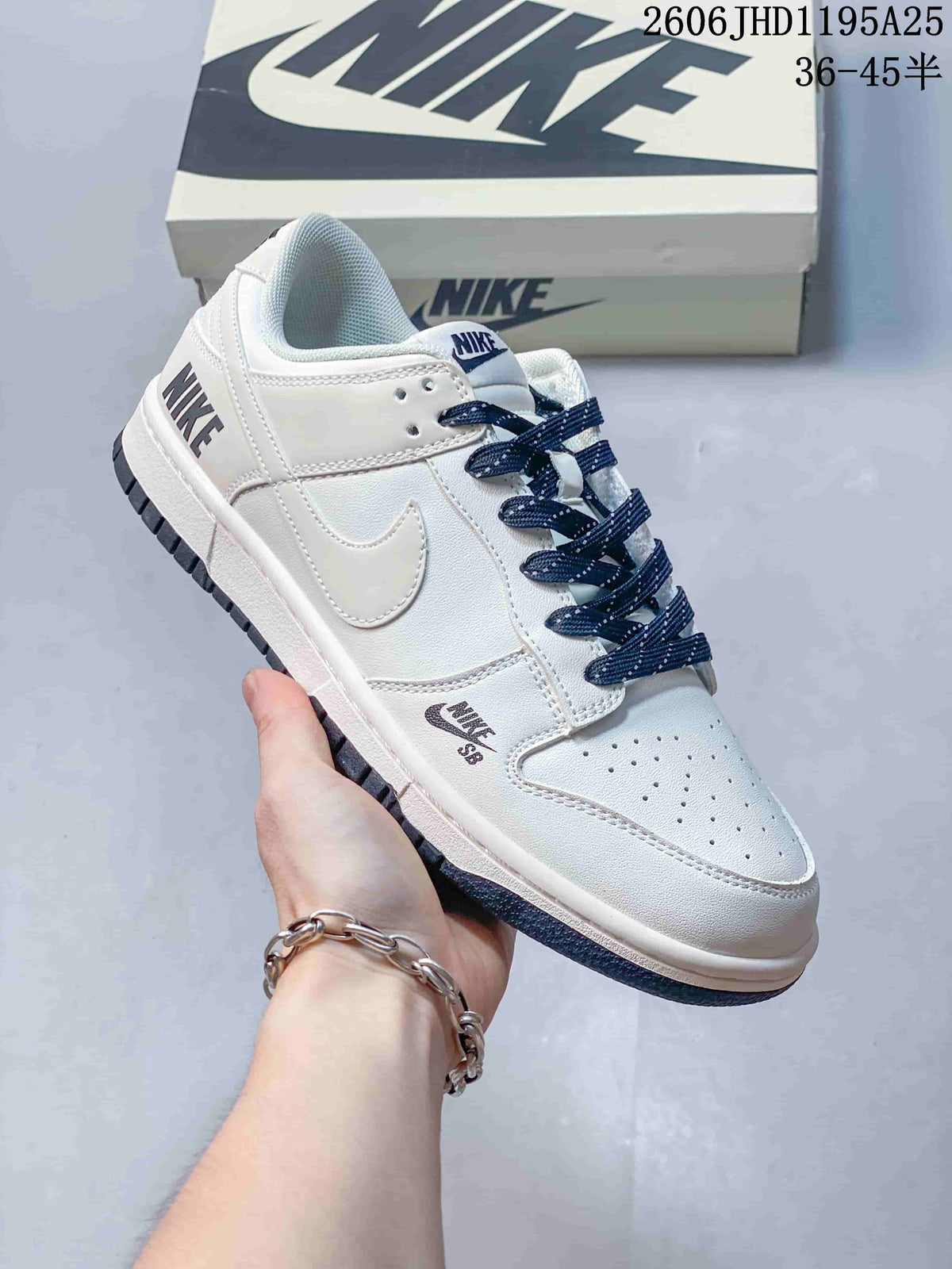 Nike Dunk Low Sneakers in White and Navy with Monogram Print