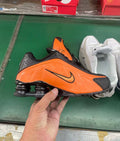 Nike Shox Orange and Black Sneakers